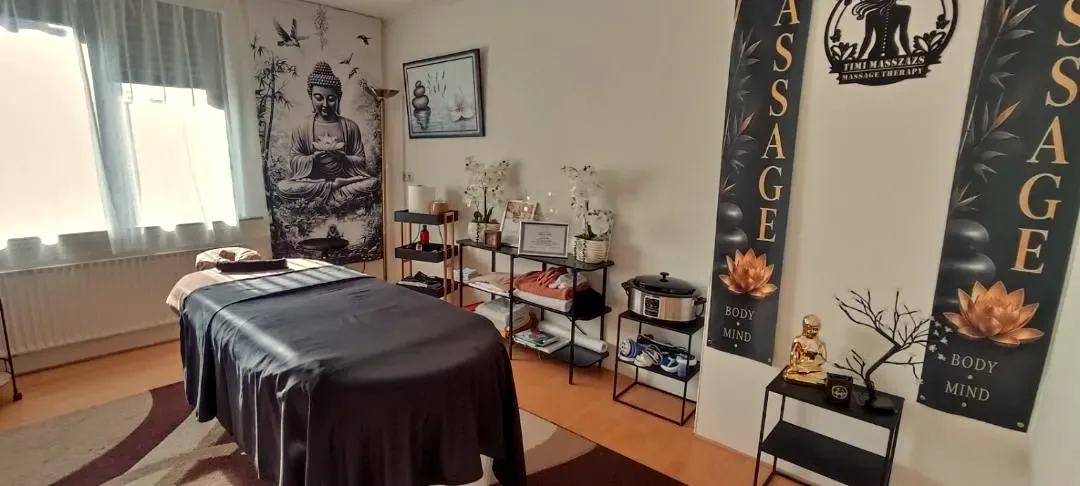 Massage room with Buddha wall art and lotus banners